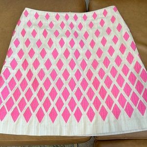 BODEN - A-Lined skirt with pink diamonds, side pockets and zipper back closure.